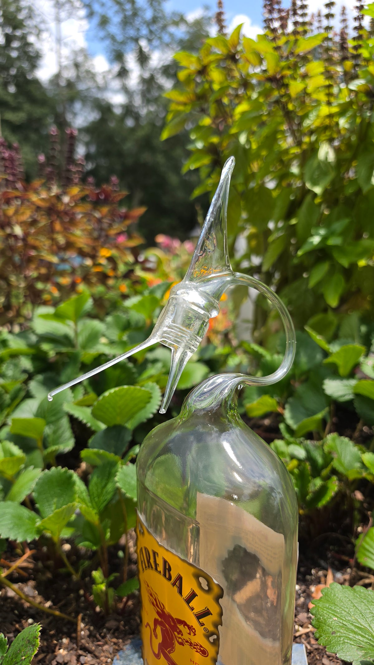 Fiery Glass Marlin Bottle Sculpture – Handcrafted Fishing Art
